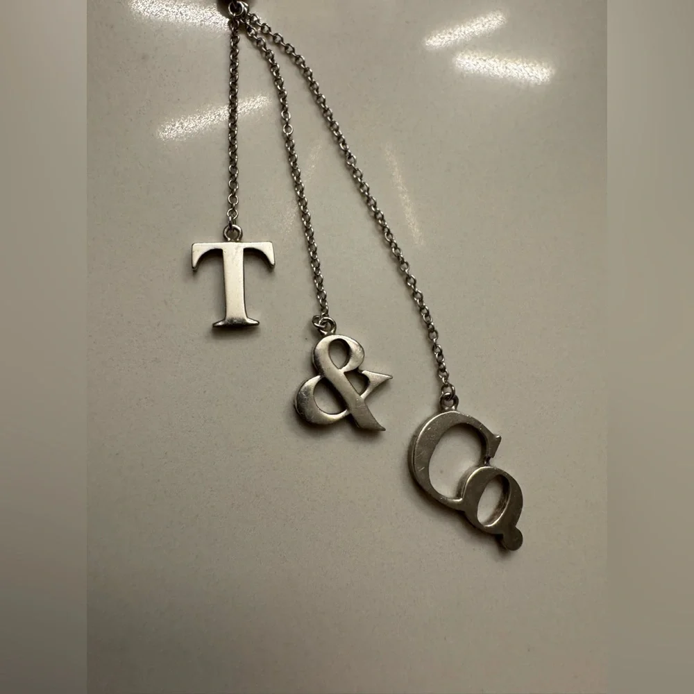 Tiffany & Co. Rare 925 Silver T&Co Dangle Letters Logo Pendant 16